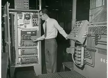 photo of Man-checking-on-PLCs