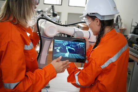 Factory worker using digital twin interface