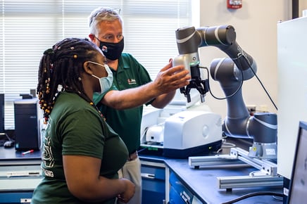 picture of humans and cobot